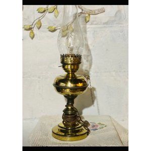 A beautiful vintage brass lamp with glass chimney, old oil lamp converted to ele